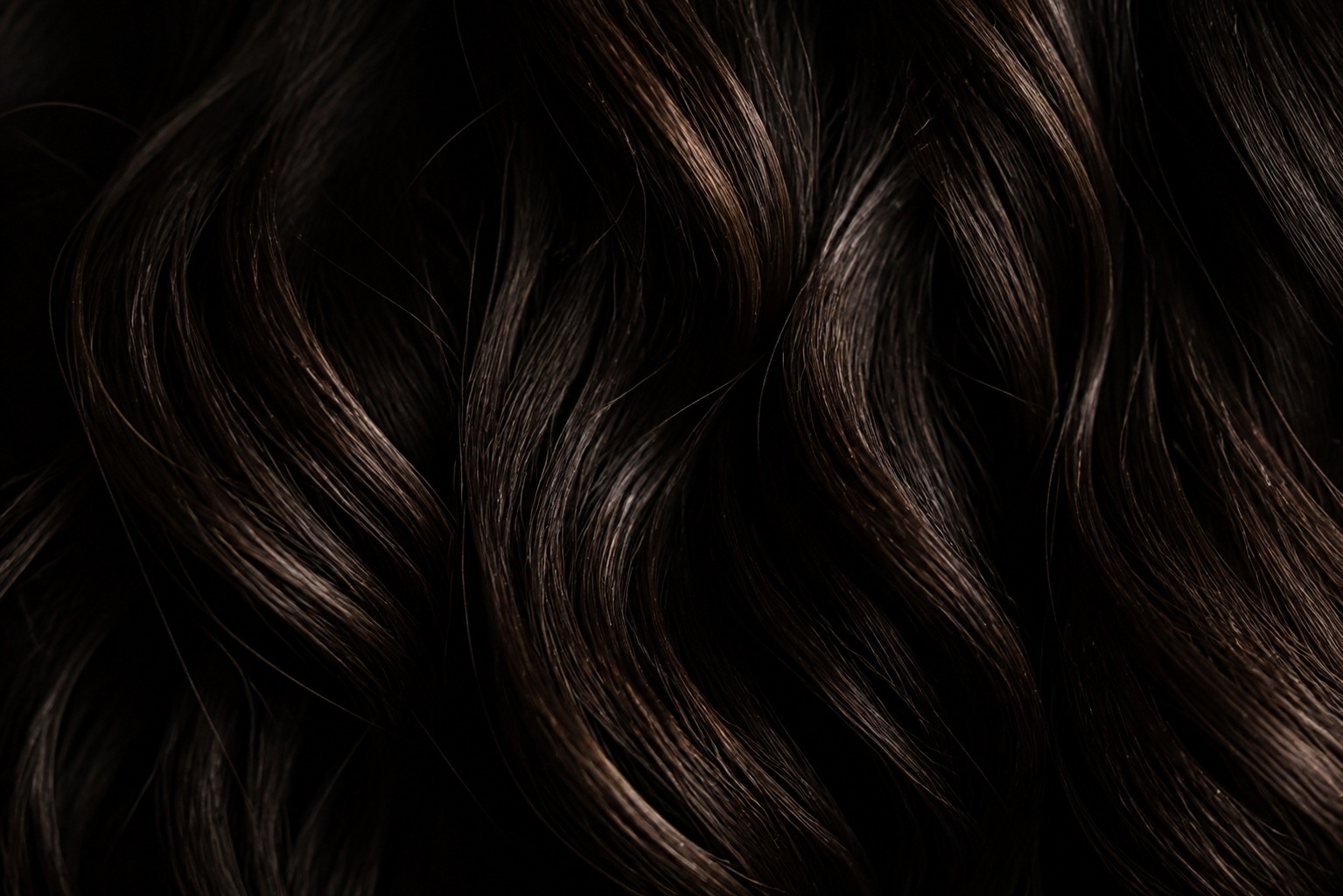 Textured dark hair showing the soft wave of a men's perm, MANE Hair Experience Singapore